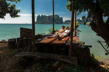 Couple in love on an island off the coast. Couple by the sea. Man and woman travel to beautiful...
