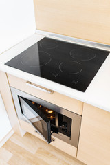 modern induction cooker stove on a beautiful empty kitchen