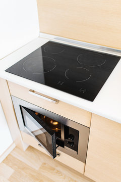 modern induction cooker stove on a beautiful empty kitchen