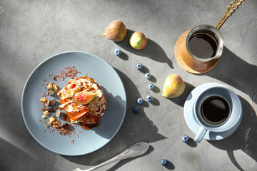 Delicious cake with caramel sauce on plate