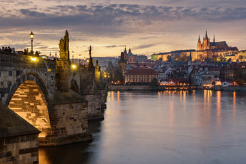 Fototapeta na wymiar Charles Bridge and Prague Castle in Prague with sunset sky in background