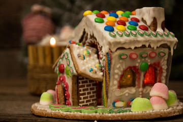 Gingerbread house. Christmas holiday sweets. European Christmas holiday traditions. Christmas gingerbread house and holiday decorations.