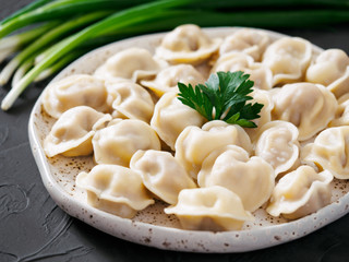 Russian pelmeni, ravioli, dumplings with meat
