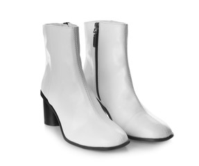 Pair of stylish female boots on white background