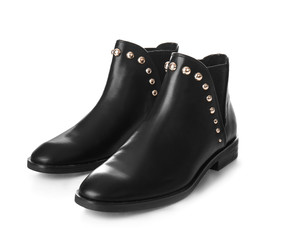 Pair of black female boots on white background