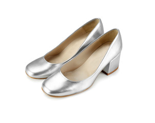 Pair of silver female shoes on white background