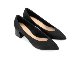 Pair of black female shoes on white background