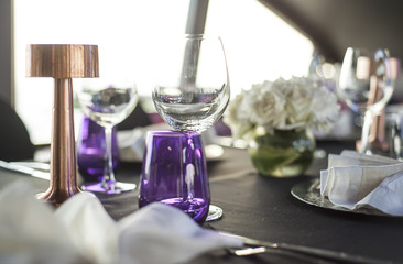 Table setup at dinner party, purple color theme
