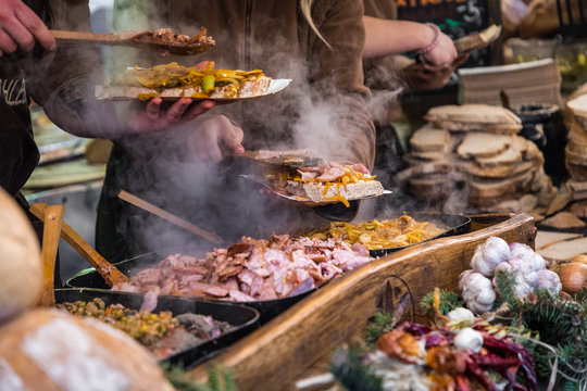 Food Booth Selling Traditional Polish Street Food In Main Square, Kraków At Christmas Market.