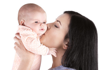 Young mother and cute baby on white background