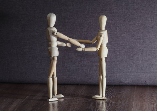 Wooden figures of people who found each other. Love.