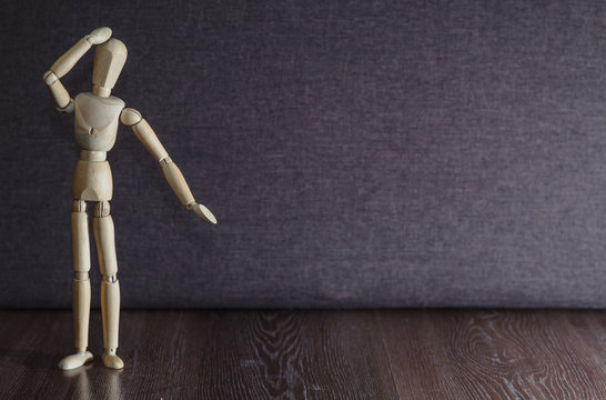 A figurine of a wooden man remembers what happened