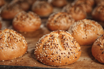 Tasty buns with sesame, closeup