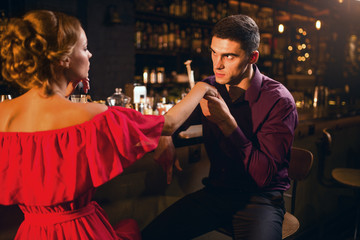 Romantic date in restaurant, woman flirts with man