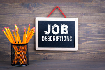 Job Descriptions. Career and success concept. Chalkboard on a wooden background.