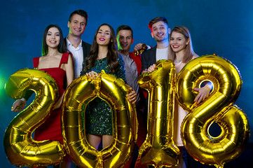 New Year's holiday with friends. The new year 2018. A group of happy young friends in beautiful...