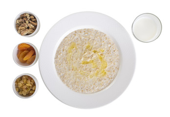 Oatmeal with dried fruits and milk.