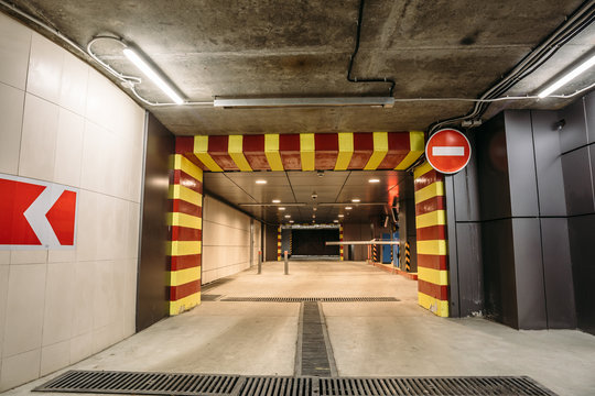 Departure from Underground garage or modern car parking and road sign stop