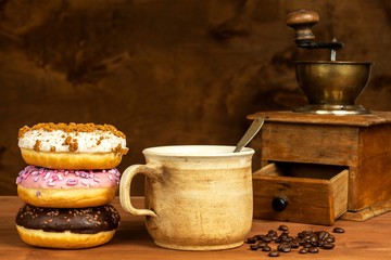 Donuts with coffee. Advertising for the sale of sweets. Sweet breakfast. Risk of obesity.