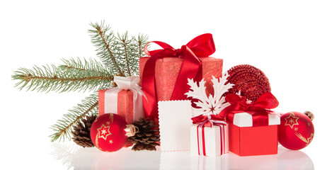Large and small boxes with gifts, pine branch, cones, toys, and empty card isolated on white