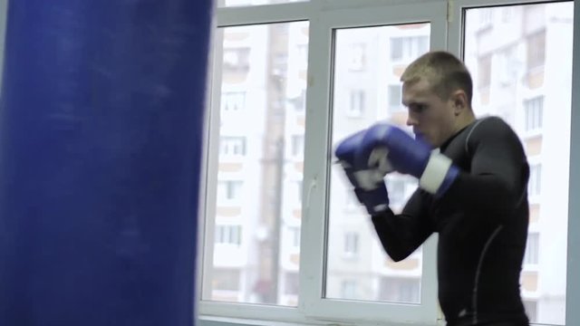 Young boxer with sports pear
