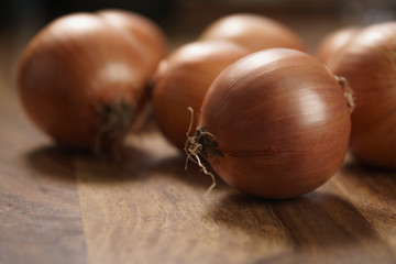 brown onions on old wood table