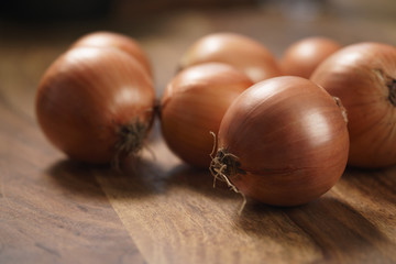 brown onions on old wood table