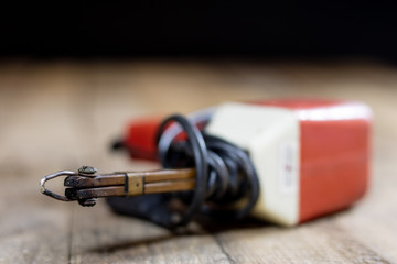 Electronic workshop. Electric meter and soldering iron.