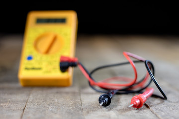 Electronic workshop. Electric meter and soldering iron.