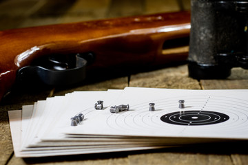 shooting, pneumatic weapon with shield and shotgun at the shooting range