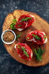 salted bresaola beef, Italian bruschetta with soft chees, onions, whole grain mustard, chillies and fresh rosmary.