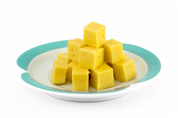 Cube of cheese isolated on a white background.