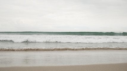 small waves on Santa Monica beach in cloudy november day