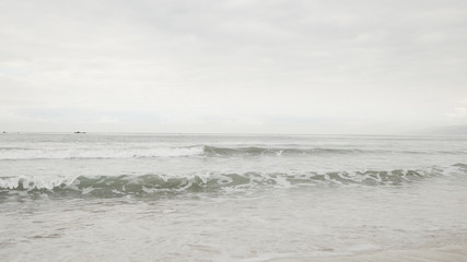 small waves on Santa Monica beach in cloudy november day