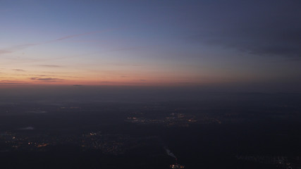 handheld shot flying on airplane over night citys grainy