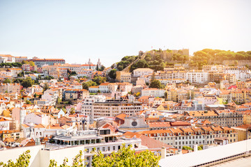 Cityscape view on the old town with castle hill during the sunny weather in Lisbon city, Portugal