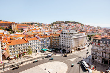 Fototapeta na wymiar Top cityscape view on the old town with Rossio square and castle hill on the background in Lisbon, Portugal