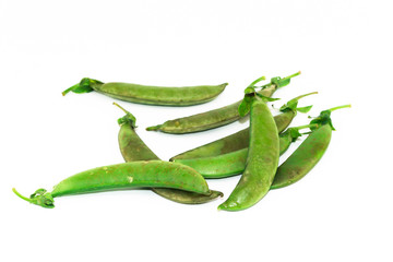 Old green with brown of sugar Peas on white background