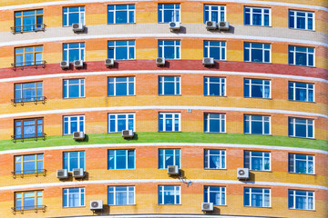 Facade of a modern residential building with air conditioning  (background, texture)