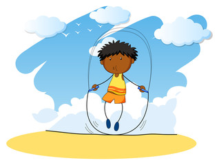 Boy jumping rope at day time