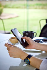 Woman using laptop smartphone paying online 