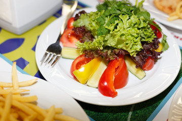 Plate with vegetables on the table