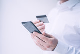 Man with smartphone and credit card