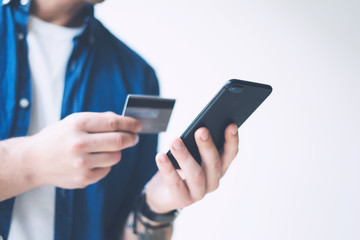 Man with smartphone and credit card