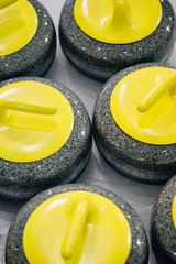 Yellow Granite stones for curling game. Sport equipment
