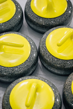 Yellow Granite stones for curling game. Sport equipment