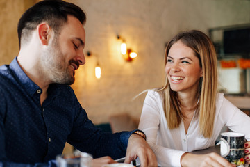 Young couple having a conversation in a cafe