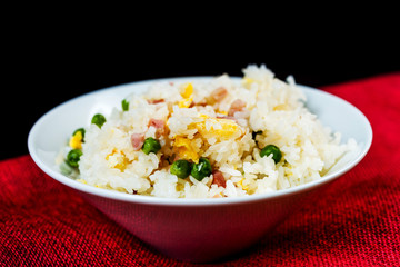 Homemade Chinese fried rice with vegetables and fried eggs