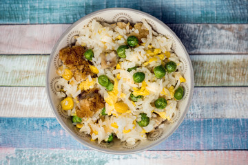 Homemade Chinese fried rice with vegetables and fried eggs