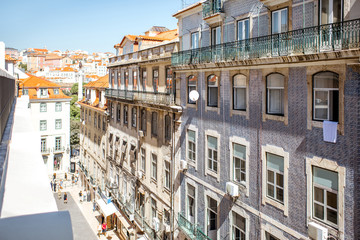 Street view with beautiful buildings in the old town of Lisbon city, Portugal